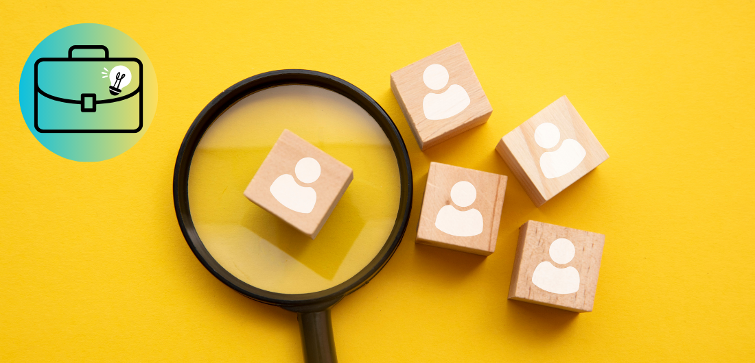 Suurennuslasin alla henkilö-symboli.